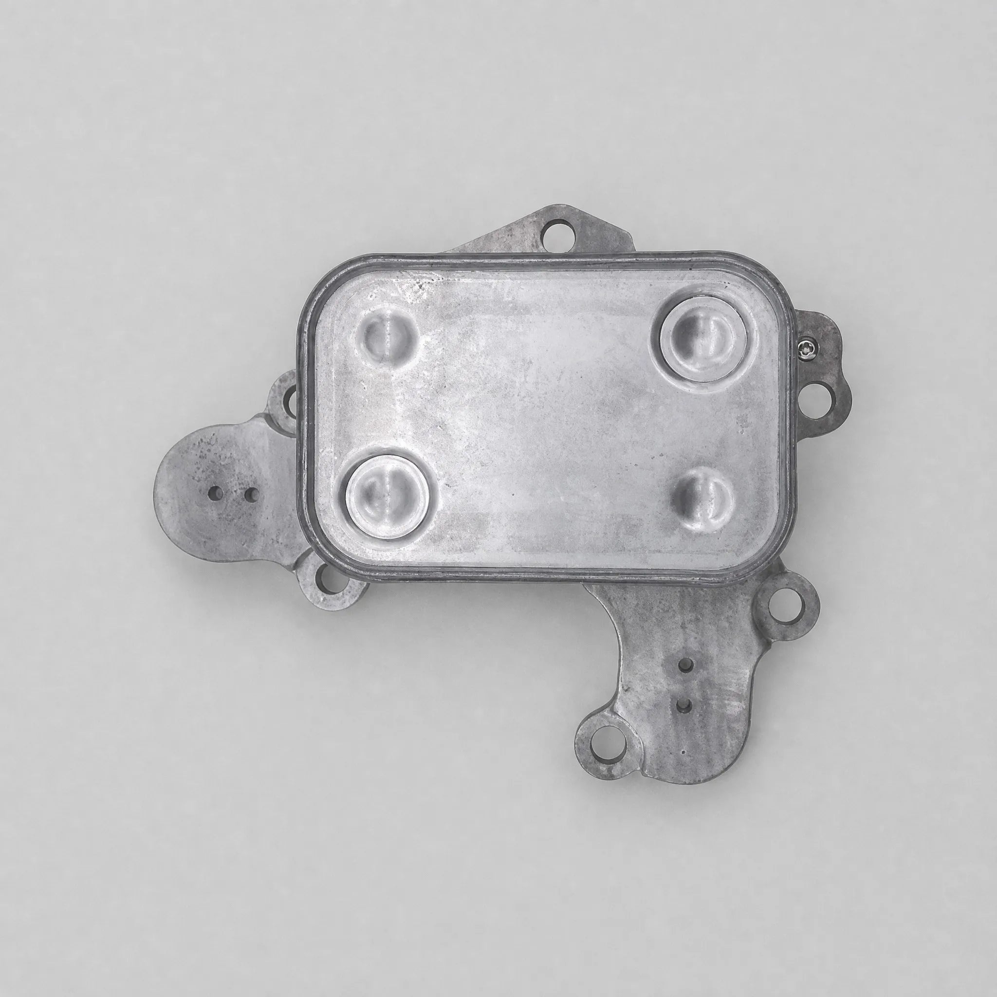 Automotive oil cooler component flat-lay view
