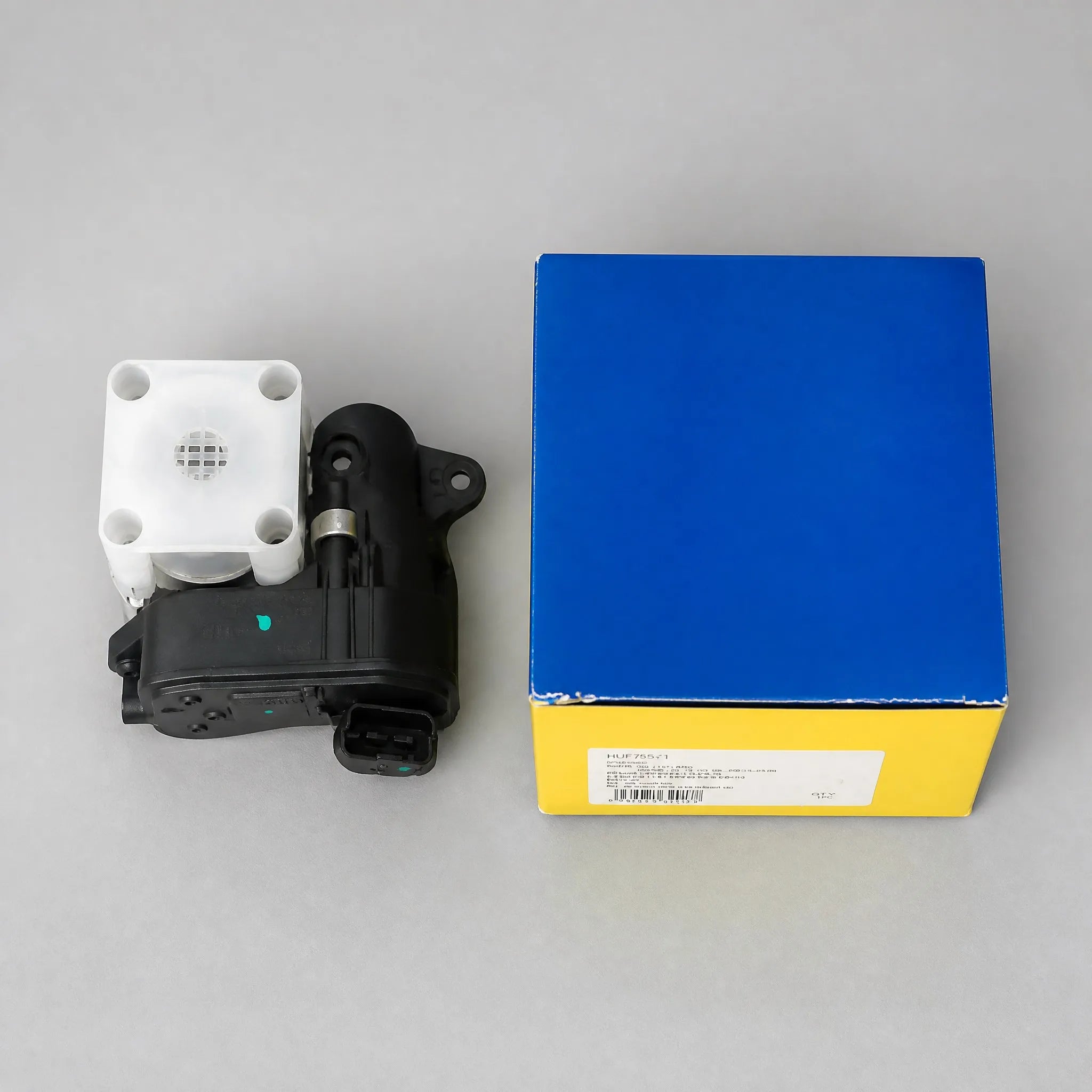 Automotive actuator motor component flat-lay view